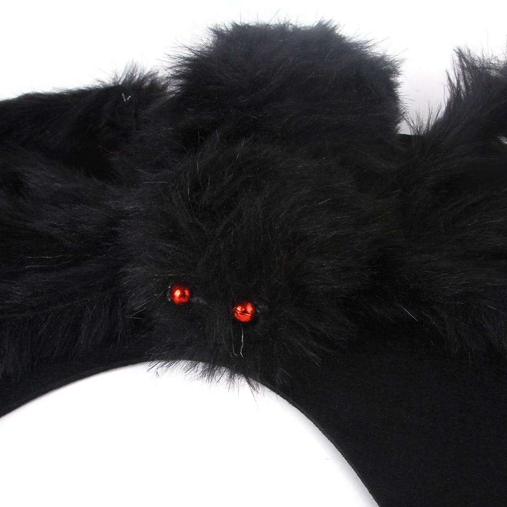 Close-up of plush spider costume with red eyes