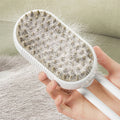 Furly Steam Brush with collected pet fur showing grooming results
